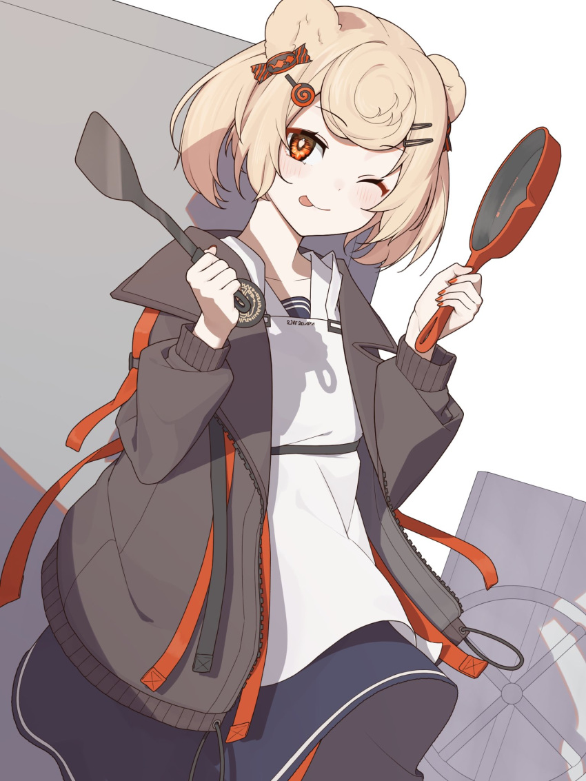 1girl ;p animal_ears arknights bear_ears bear_girl black_jacket black_skirt blonde_hair candy_hair_ornament collarbone eyebrows_visible_through_hair food-themed_hair_ornament frying_pan gummy_(arknights) hair_ornament hairclip highres holding holding_frying_pan holding_spatula jacket long_sleeves one_eye_closed open_clothes open_jacket orange_eyes short_hair shoujo_l skirt smile solo spatula tongue tongue_out