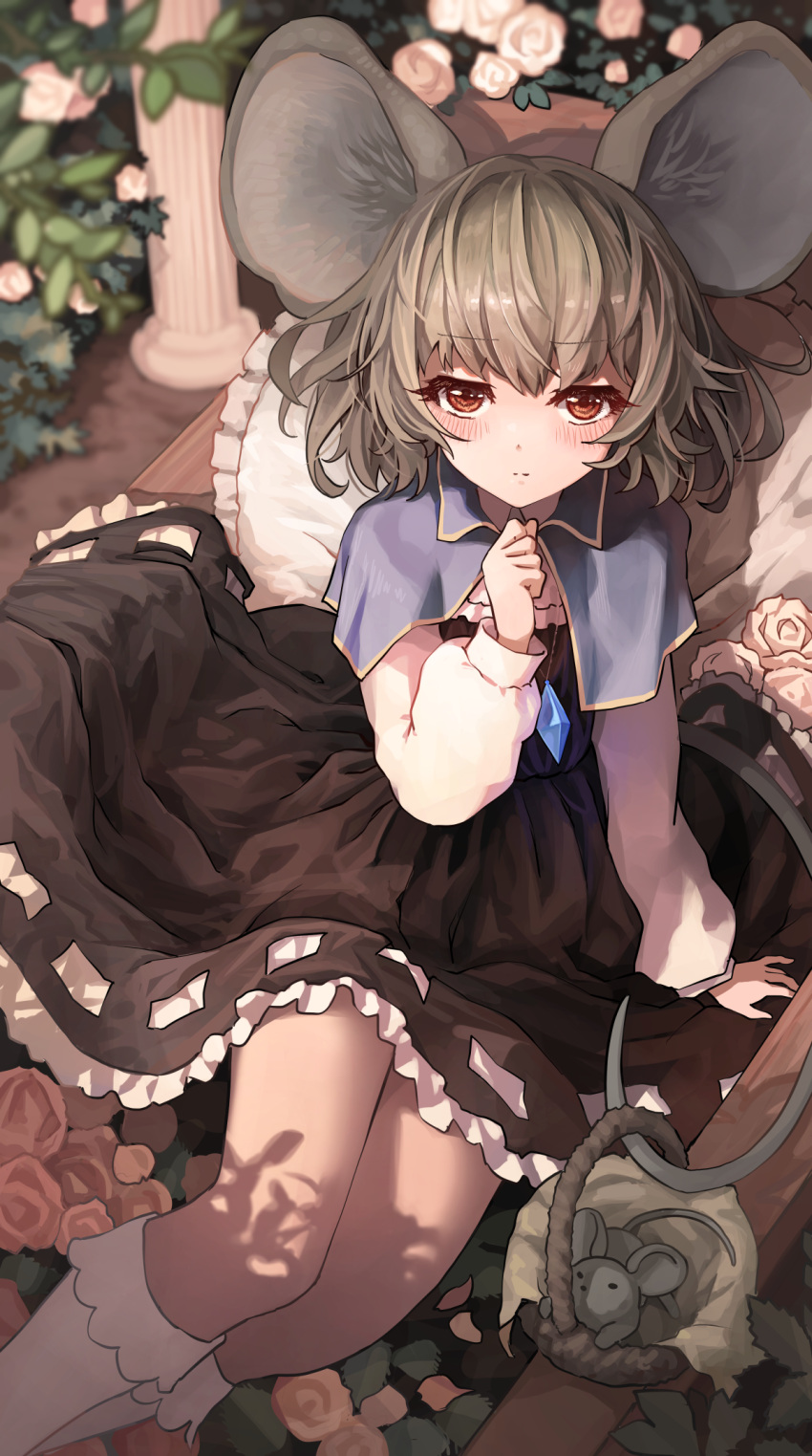 1girl animal_ears basket black_dress blue_capelet blurry blurry_background blush capelet closed_mouth commission dress eyebrows_visible_through_hair flower grey_hair highres jewelry light_smile long_sleeves looking_at_viewer medium_hair melaton mouse mouse_ears nazrin outdoors pendant pillar pillow red_eyes shirt sitting skeb_commission touhou white_legwear white_shirt