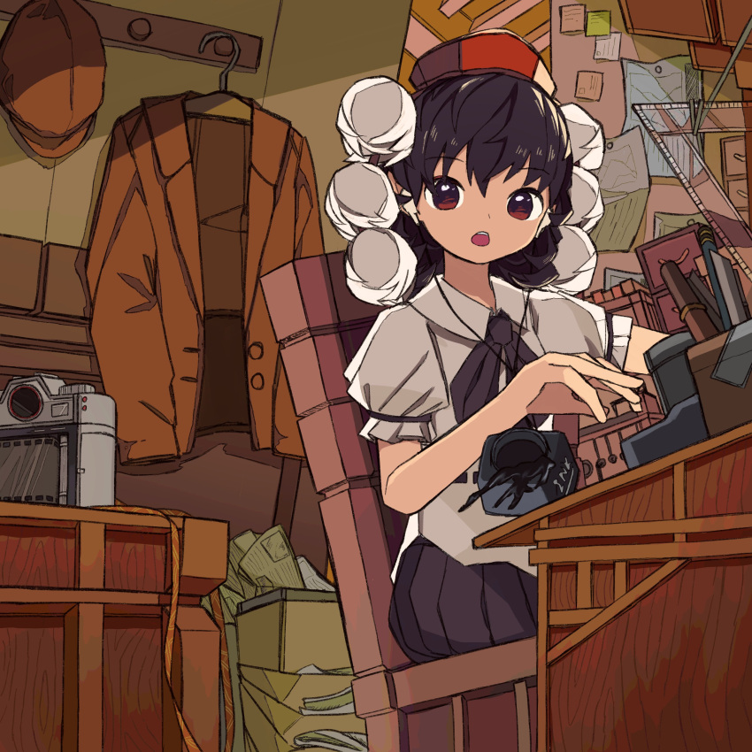1girl :o absurdres accident black_hair black_skirt brown_headwear brown_jacket camera commentary desk falling hangar hat highres indoors ink ink_bottle jacket looking_away neck_ribbon neruzou on_chair pleated_skirt pom_pom_(clothes) puffy_short_sleeves puffy_sleeves ribbon shameimaru_aya short_sleeves sitting skirt solo tokin_hat touhou working
