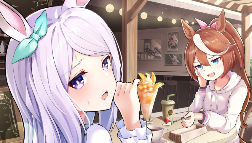 2girls animal_ears bangs blue_eyes breasts brown_hair cafe commentary cup disposable_cup drinking_straw eyebrows_visible_through_hair hair_between_eyes head_rest high_ponytail highres hood hoodie horse_ears horse_girl long_hair long_sleeves looking_at_viewer looking_back medium_breasts mejiro_mcqueen_(umamusume) multicolored_hair multiple_girls offering on_chair open_mouth outstretched_hand parfait ponytail shirt sitting smug streaked_hair sunny_(20597521) sweat tea teacup tokai_teio_(umamusume) two-tone_hair umamusume upper_body violet_eyes white_hair white_hoodie