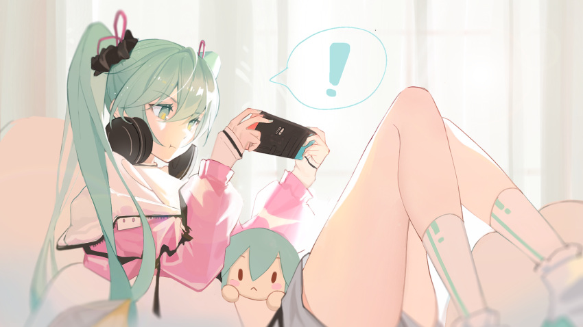 ! 1girl aqua_eyes aqua_hair aqua_nails bangs breasts chinese_commentary closed_mouth commentary_request crossed_legs day ellase eyebrows_visible_through_hair feet_out_of_frame grey_shorts hair_between_eyes hair_ornament hair_ribbon handheld_game_console hands_up hatsune_miku headphones headphones_around_neck highres holding holding_handheld_game_console jacket leaning_back long_hair looking_away nintendo_switch off_shoulder open_clothes open_jacket pillow pink_jacket ribbon screen_light scrunchie shirt shorts sitting sky sleeves_past_wrists small_breasts socks solo speech_bubble stuffed_toy sunlight twintails vocaloid white_legwear white_shirt window