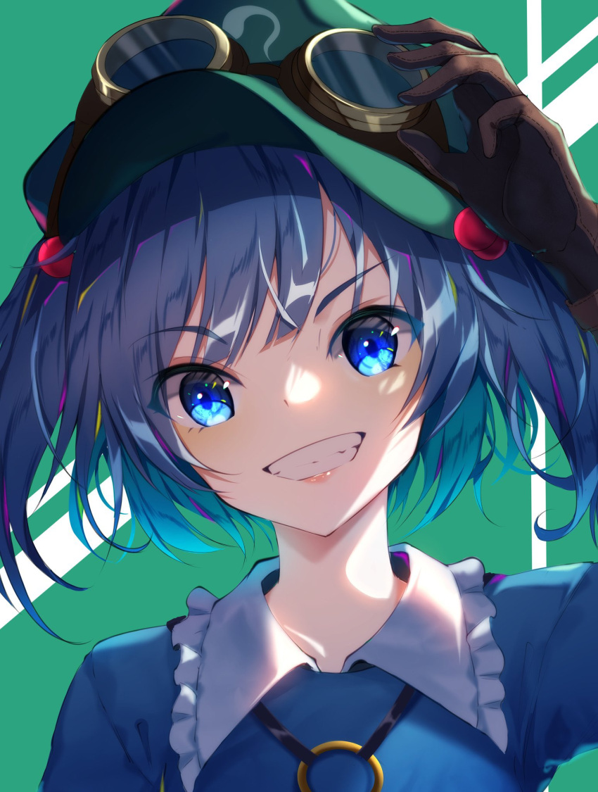 1girl arm_up bangs blue_dress blue_eyes blue_hair blush brown_gloves commentary_request dress eyebrows_visible_through_hair frilled_shirt_collar frills gloves goggles goggles_on_headwear green_background green_headwear grin hair_bobbles hair_ornament highres kawashiro_nitori lips long_sleeves short_hair smile solo teeth touhou two_side_up upper_body yamanakaume