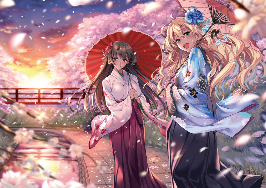 2girls :d black_hakama blush brown_hair cherry_blossoms day flower green_eyes hair_flower hair_ornament hakama hakama_skirt highres holding holding_umbrella japanese_clothes kimono long_hair long_sleeves looking_at_viewer multiple_girls oil-paper_umbrella original outdoors own_hands_together piromizu red_eyes red_flower red_hakama red_umbrella river skirt smile stitched sunset umbrella wide_sleeves