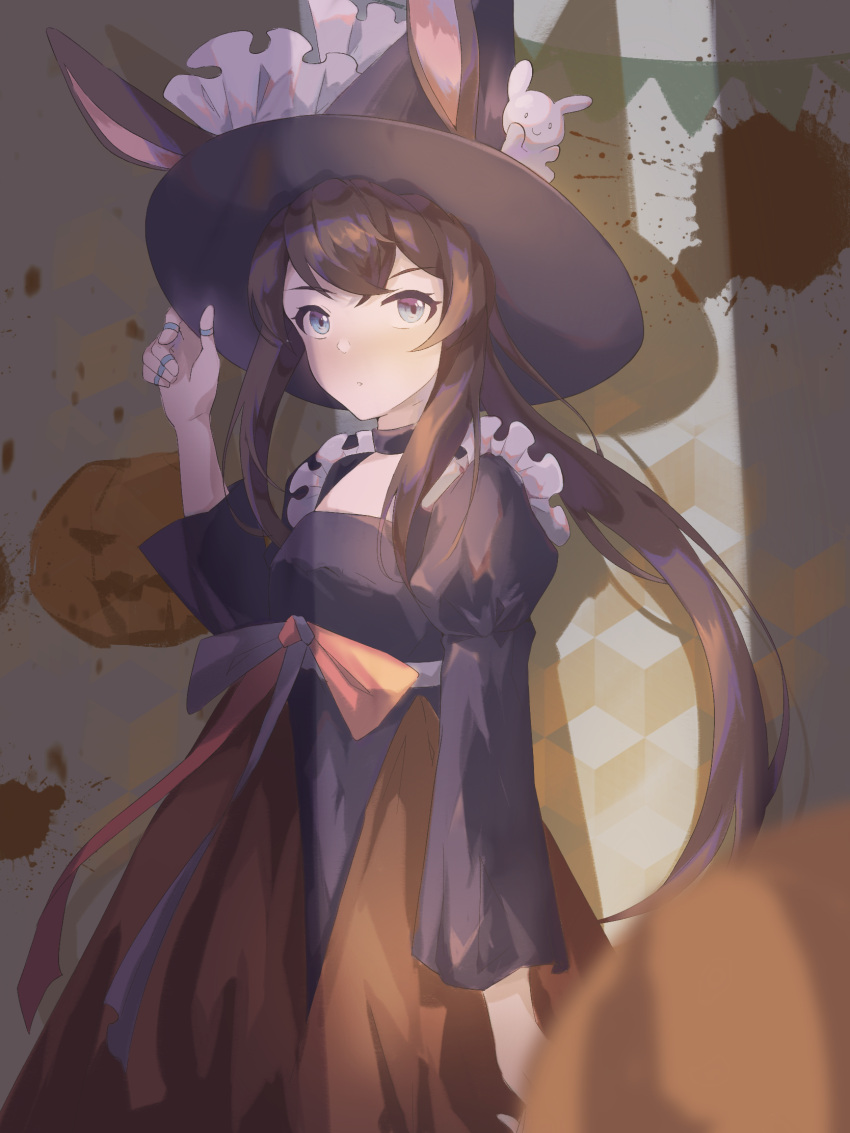1girl alternate_costume amiya_(arknights) arknights black_dress black_headwear blood blood_splatter blue_eyes blush brown_hair chinese_commentary commentary_request cotayomengmiao dress ears_through_headwear hat highres jewelry long_hair looking_at_viewer multiple_rings procreate_(medium) pumpkin ring sidelocks solo stuffed_animal stuffed_bunny stuffed_toy thumb_ring upper_body very_long_hair witch_hat