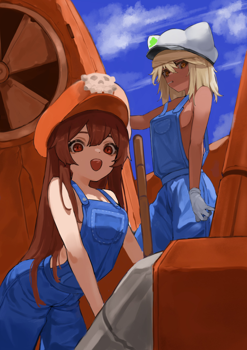 2girls :d bangs bare_arms bare_shoulders blue_overalls blue_sky breasts brown_eyes brown_hair clouds cloudy_sky cowboy_shot dark-skinned_female dark_skin day flasso gloves grey_gloves guilty_gear hair_between_eyes hat highres leaning_forward long_hair looking_at_viewer may_(guilty_gear) medium_breasts mouth_hold multiple_girls naked_overalls open_mouth orange_eyes orange_headwear outdoors overalls pirate_hat platinum_blonde_hair ramlethal_valentine sideboob skull_and_crossbones sky smile teeth upper_teeth very_long_hair