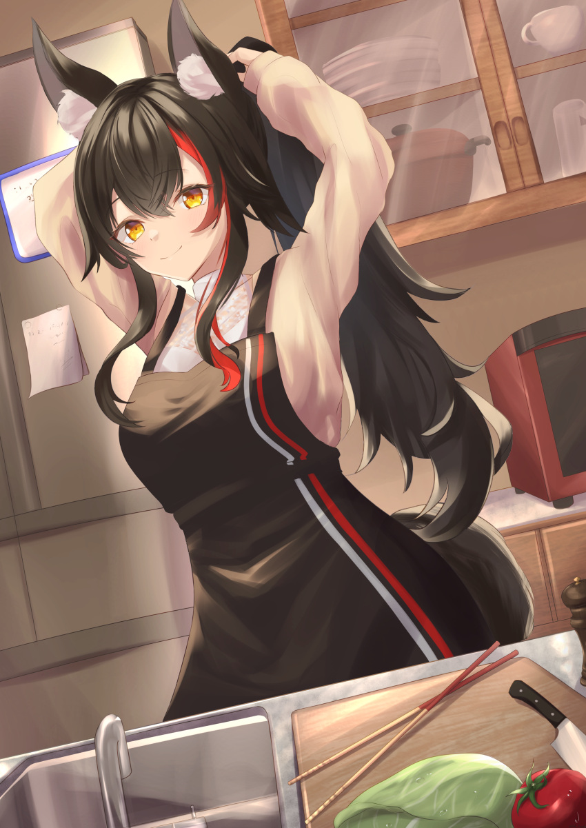 1girl absurdres animal_ear_fluff animal_ears apron bangs black_hair blush breasts chopsticks commentary_request eyebrows_visible_through_hair hair_between_eyes highres hololive indoors kitchen knife koh_kaede long_hair looking_at_viewer medium_breasts multicolored_hair ookami_mio ponytail redhead sidelocks sink smile solo streaked_hair tail tomato tying_hair virtual_youtuber wolf_ears wolf_girl wolf_tail yellow_eyes