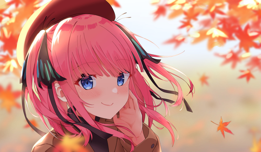 1girl autumn_leaves bangs beret black_ribbon blue_eyes blush brown_jacket closed_mouth commentary_request eyebrows_visible_through_hair go-toubun_no_hanayome hair_ribbon hand_on_own_cheek hand_on_own_face hand_up hat highres jacket leaf long_sleeves looking_at_viewer maple_leaf medium_hair nakano_nino pink_hair portrait profnote red_headwear ribbon smile solo two_side_up