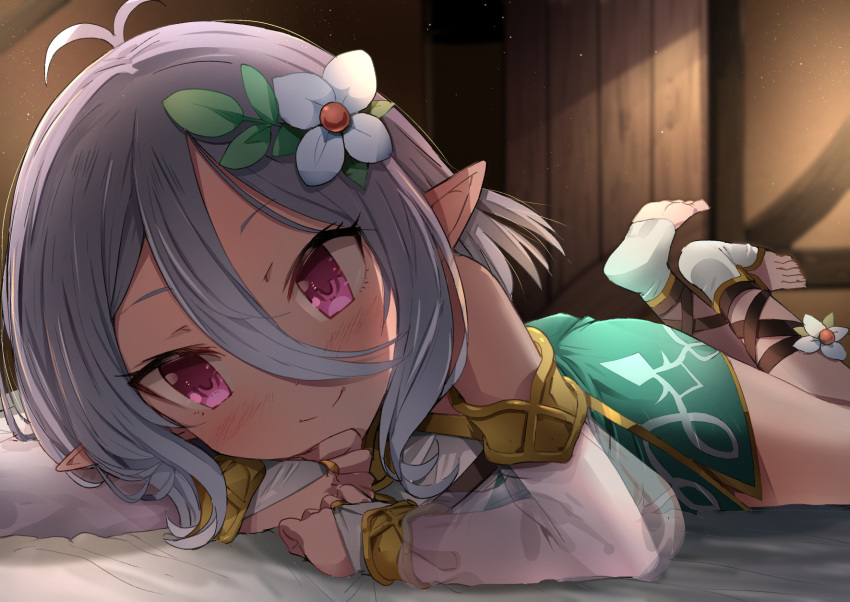 1girl bed blush detached_sleeves dress flower hair_flower hair_ornament highres kokkoro_(princess_connect!) looking_at_viewer lying natsushima_memo on_stomach pillow pink_eyes pointy_ears princess_connect! see-through_sleeves short_hair silver_hair sleeveless sleeveless_dress smile