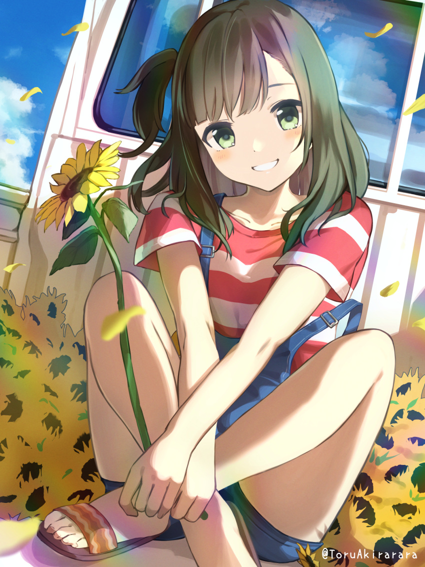 1girl akira_tooru artist_name bangs bare_legs blue_overalls blue_sky clouds commentary_request crossed_ankles day flower green_eyes green_hair grin ground_vehicle highres indian_style knees_up long_hair looking_at_viewer motor_vehicle one_side_up original outdoors overalls petals sandals shirt short_sleeves sitting sky smile solo strap_slip striped striped_shirt sunflower swept_bangs t-shirt toes truck wind