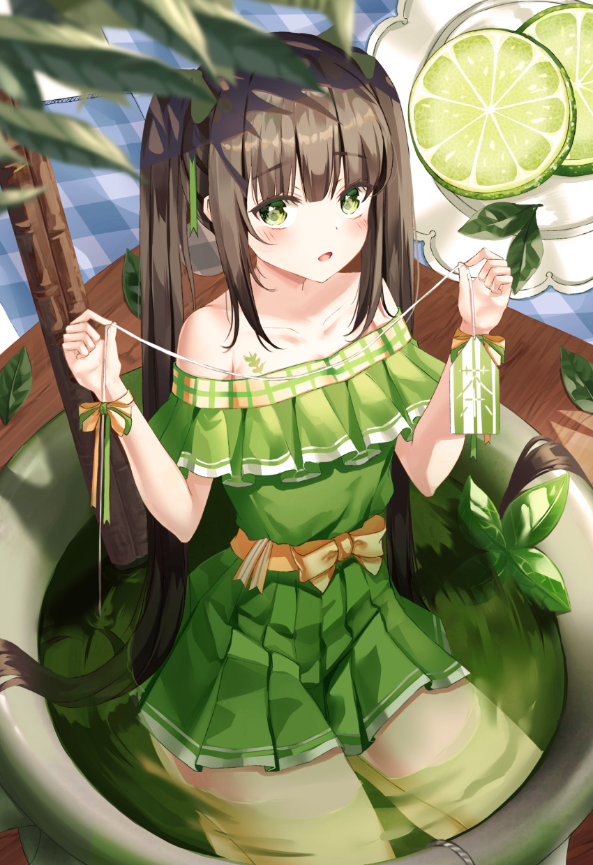 1girl absurdres bangs bare_shoulders black_hair blurry blurry_foreground blush bow collarbone commentary cup depth_of_field dress english_commentary eyebrows_visible_through_hair green_dress green_eyes green_tea highres holding in_container in_cup long_hair looking_at_viewer minigirl off-shoulder_dress off_shoulder original parted_lips pleated_dress ruda_(ruda_e) seiza sitting solo tea teabag teacup twintails very_long_hair yellow_bow