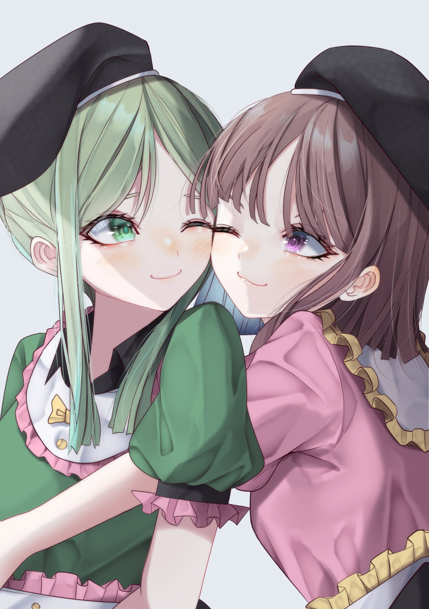 2girls absurdres apron arm_up bangs black_headwear blush bow breasts brown_hair buttons closed_mouth collar collared_dress dress eyebrows_visible_through_hair eyes_visible_through_hair green_dress green_eyes green_hair green_sleeves grey_background hand_up hat highres hug hug_from_behind looking_at_another medium_breasts multiple_girls nishida_satono one_eye_closed pink_dress pink_sleeves puffy_short_sleeves puffy_sleeves short_hair short_hair_with_long_locks short_sleeves simple_background smile teireida_mai touhou tsune_(tune) violet_eyes white_apron yellow_bow yuri