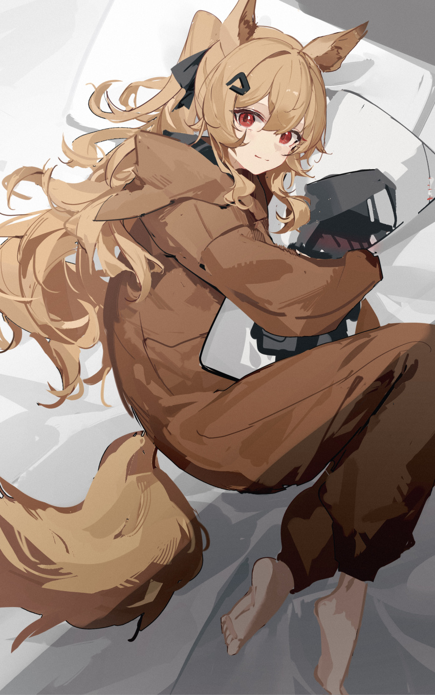 1girl absurdres animal_ears arknights bangs barefoot bed_sheet brown_hair ceobe_(arknights) closed_mouth dakimakura_(object) doctor_(arknights) dog_ears dog_girl dog_tail from_above hair_ornament hairclip highres hood hood_down long_hair long_sleeves looking_at_viewer looking_up luozhou_pile lying object_hug official_alternate_costume on_bed on_side onesie pillow ponytail red_eyes smile solo tail very_long_hair