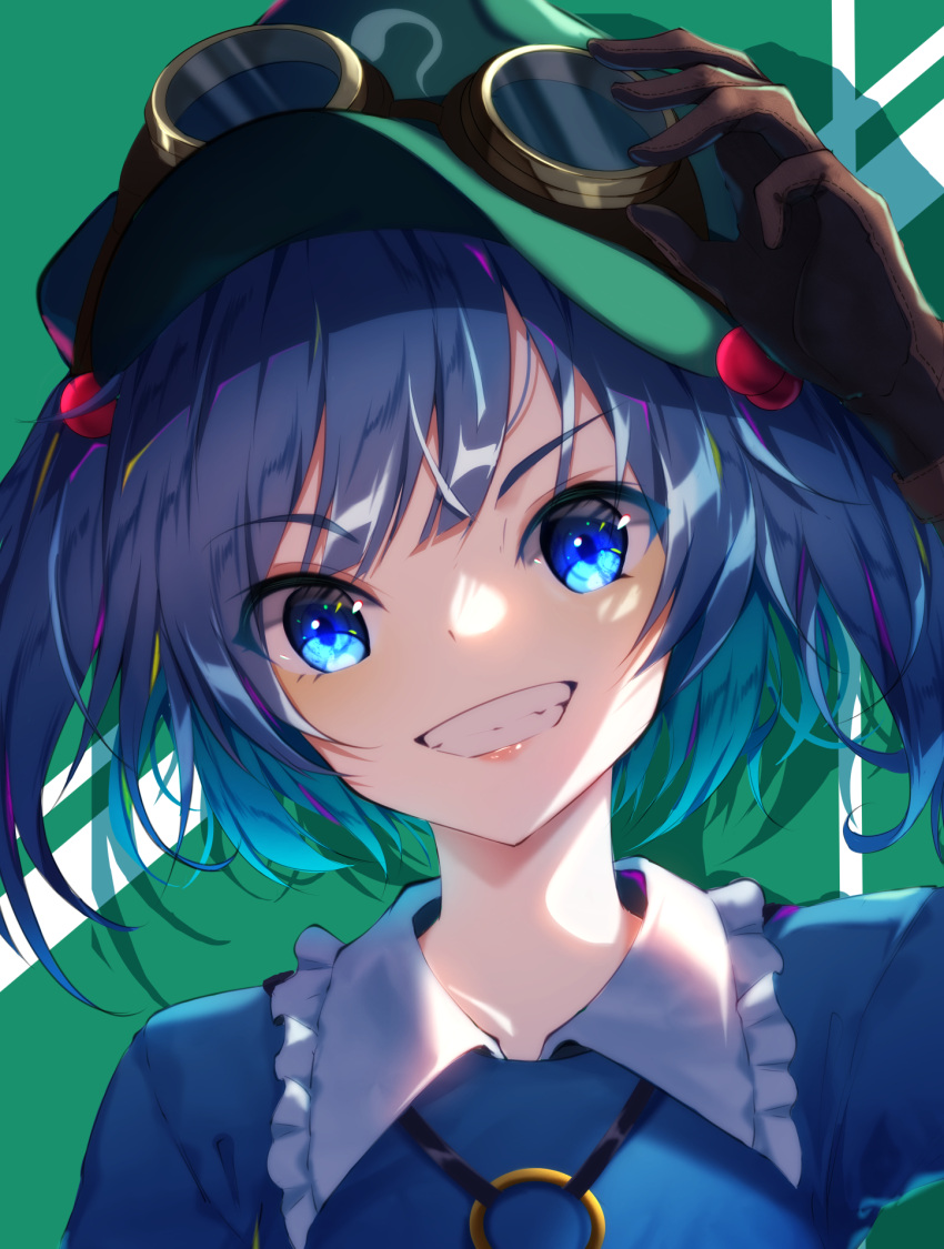 1girl arm_up bangs blue_dress blue_eyes blue_hair blush brown_gloves commentary_request dress eyebrows_visible_through_hair frilled_shirt_collar frills gloves goggles goggles_on_headwear green_background green_headwear grin hair_bobbles hair_ornament highres kawashiro_nitori lips long_sleeves short_hair smile solo teeth touhou two_side_up upper_body yamanakaume