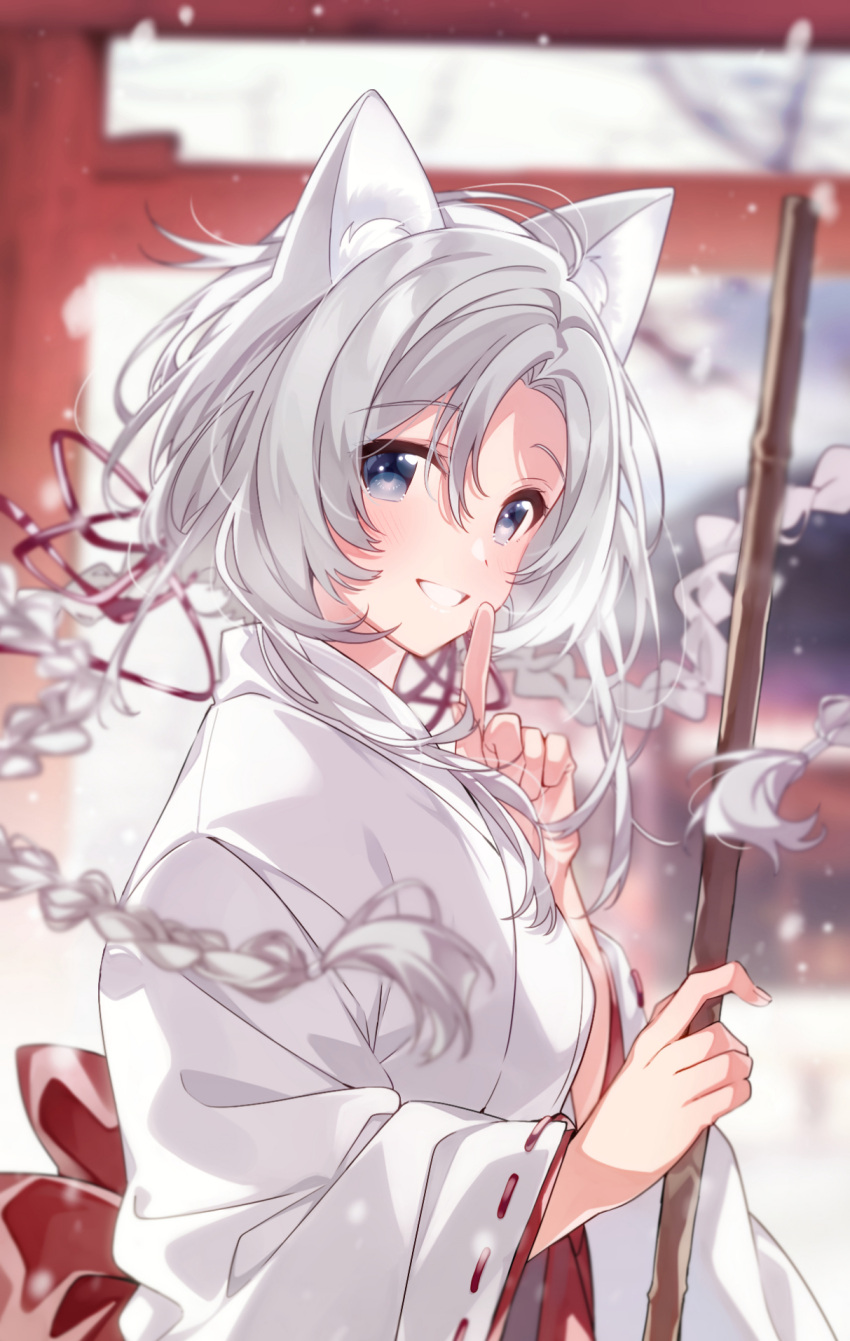 1girl :d animal_ear_fluff animal_ears back_bow bamboo_broom blue_eyes blurry blurry_background blush bow braid broom cat_ears day depth_of_field eyebrows_visible_through_hair finger_to_mouth floating_hair from_side grin hair_ribbon highres holding holding_broom index_finger_raised japanese_clothes kimono long_hair long_sleeves looking_at_viewer looking_to_the_side miko original outdoors parted_lips red_bow red_ribbon ribbon shushing silver_hair smile snowing solo teeth torii twin_braids u35 upper_teeth white_kimono winter