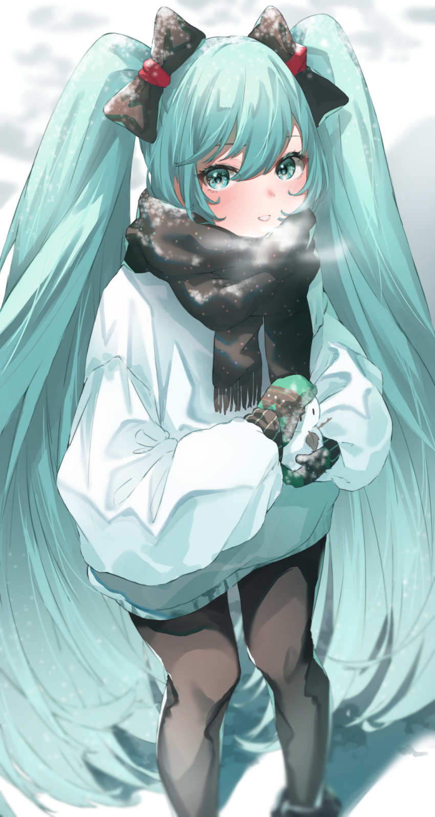 1girl aqua_eyes aqua_hair azusa_(azunyan12) black_bow black_legwear black_scarf blurry blush bow breath commentary depth_of_field feet_out_of_frame from_above green_mittens hair_bow hatsune_miku highres holding_snowman jacket lips long_hair looking_at_viewer mittens outdoors parted_lips scarf snow snowman solo standing twintails very_long_hair visible_air vocaloid white_jacket winter