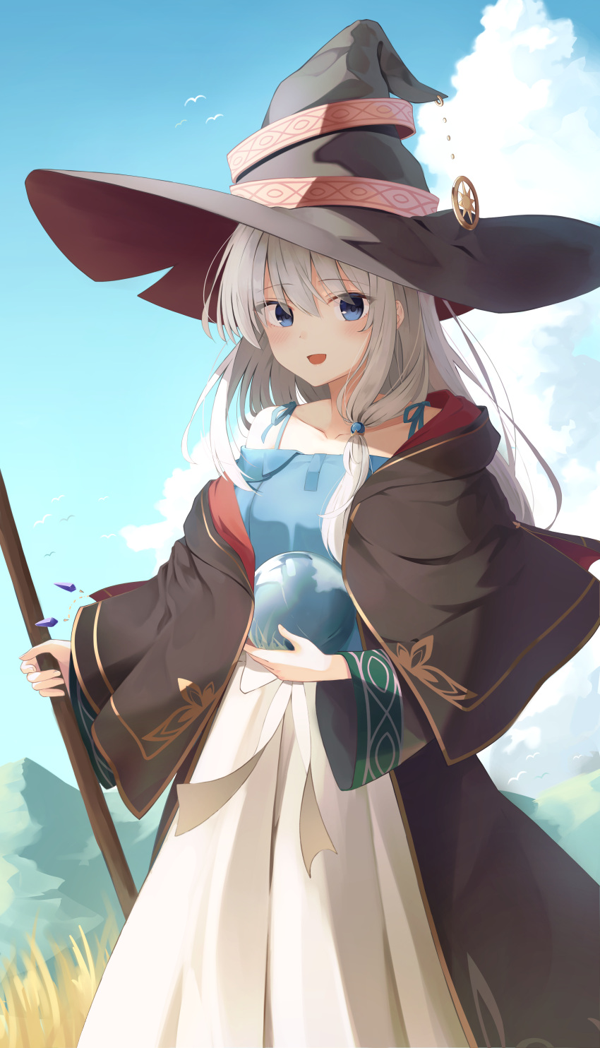 1girl absurdres bangs bird black_capelet black_coat black_headwear blue_dress capelet clouds coat commentary crystal_ball day dress elaina_(majo_no_tabitabi) eyebrows_visible_through_hair grey_hair hair_between_eyes hat highres holding long_sleeves looking_at_viewer majo_no_tabitabi open_mouth opm7760 outdoors smile solo standing two-tone_dress white_dress wide_sleeves witch_hat