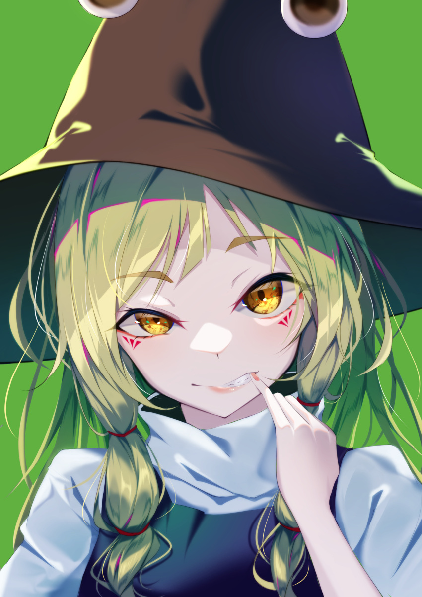 1girl bangs blonde_hair blue_dress brown_headwear closed_mouth dress eyebrows_visible_through_hair eyes_visible_through_hair green_background hair_ornament hand_up hat highres long_sleeves looking_at_viewer moriya_suwako pink_nails shirt simple_background solo teeth touhou upper_body white_shirt wide_sleeves yamanakaume yellow_eyes