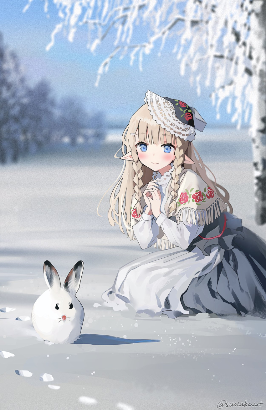 1girl bangs blonde_hair blunt_bangs blunt_ends blurry blush braid depth_of_field field footprints highres lace-trimmed_collar lace-trimmed_headwear lace_trim looking_at_animal original outdoors own_hands_together pointy_ears print_capelet rabbit sidelocks snow squatting sunako_(veera) twitter_username winter
