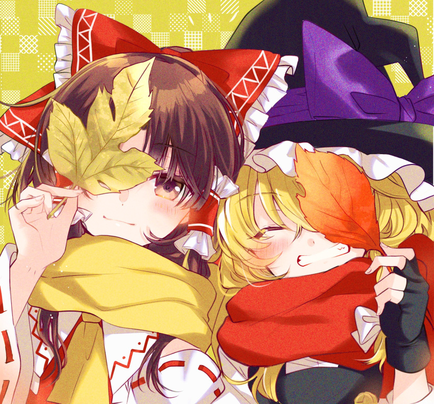 2girls ascot autumn_leaves bangs black_gloves black_headwear black_vest blush bow brown_eyes brown_hair buttons checkered_background closed_eyes closed_mouth fingerless_gloves frilled_bow frilled_hair_tubes frills gloves grin hair_bow hair_tubes hakurei_reimu hat hat_bow hat_ribbon highres holding holding_leaf kirisame_marisa leaf long_hair looking_at_viewer multiple_girls nontraditional_miko open_mouth poprication purple_bow purple_ribbon red_bow red_vest ribbon sidelocks smile standing symbol-only_commentary teeth touhou upper_body vest witch_hat yellow_ascot yellow_background