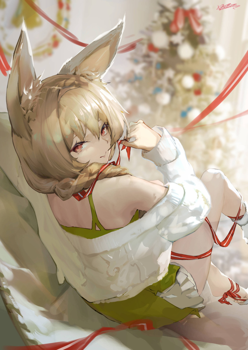 1girl absurdres animal_ear_fluff animal_ears arknights bare_shoulders barefoot beanstalk_(arknights) beanstalk_(gift_uncompleted)_(arknights) blurry blurry_background braid brown_hair christmas_tree closed_mouth depth_of_field dress from_behind green_dress hair_over_shoulder highres kioroshin kneehighs long_hair long_sleeves looking_at_viewer looking_back off-shoulder_sweater off_shoulder official_alternate_costume red_eyes short_dress signature single_braid single_kneehigh sitting smile solo sweater symbol-only_commentary white_legwear white_sweater