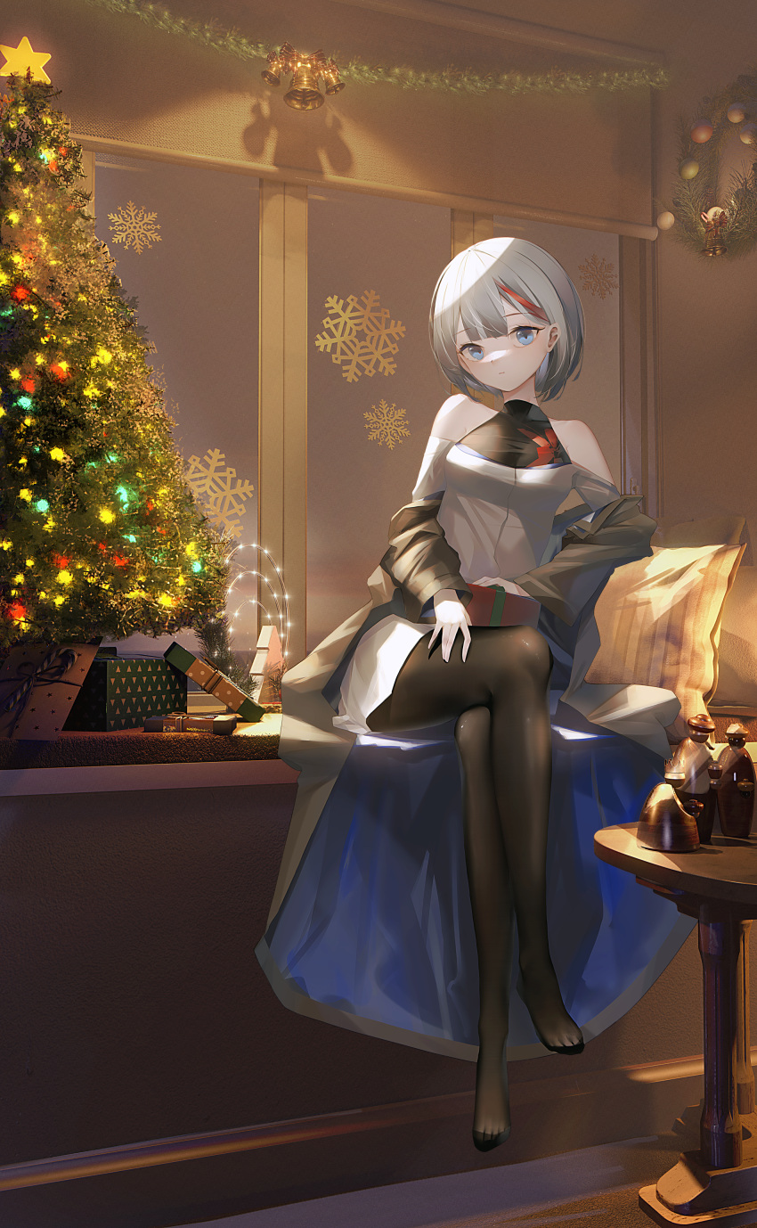 1girl :| absurdres admiral_graf_spee_(azur_lane) alternate_costume azur_lane bare_shoulders black_legwear blue_eyes breasts christmas_ornaments christmas_present christmas_tree closed_mouth crossed_legs dress gift halterneck head_tilt highres holding holding_gift indoors ka11_ca looking_at_viewer medium_breasts multicolored_hair no_shoes off_shoulder pantyhose pillow redhead short_hair silver_hair sitting solo streaked_hair tinsel toes white_dress wreath