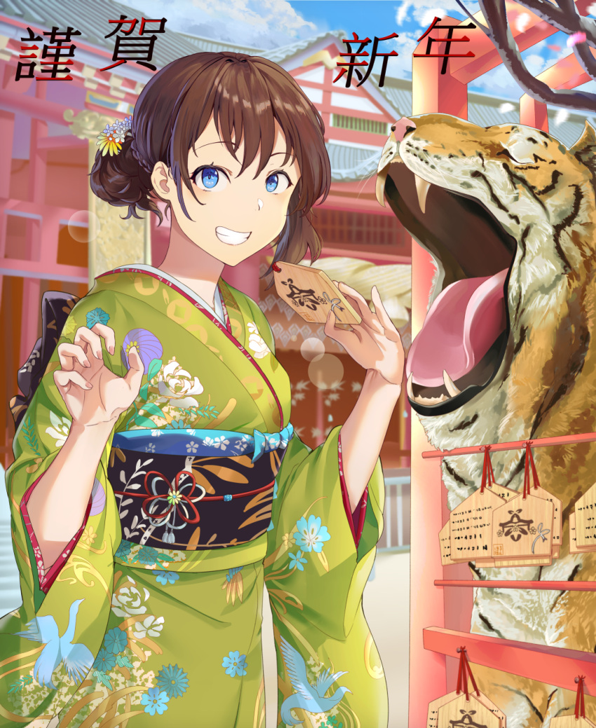 1girl animal bangs blue_eyes blue_flower branch brown_hair building chinese_zodiac claw_pose commentary_request day ema eyebrows_visible_through_hair floral_print flower green_kimono grin hair_between_eyes hair_bun hair_flower hair_ornament highres holding japanese_clothes kimono long_sleeves mosta_(lo1777789) obi original outdoors petals print_kimono sash smile solo tiger translation_request white_flower wide_sleeves year_of_the_tiger yellow_flower
