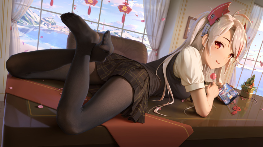 1girl :q antenna_hair azur_lane bangs black_legwear black_skirt black_vest breasts candy cellphone commentary_request crossed_ankles curtains day eyebrows_visible_through_hair feet food from_behind full_body headgear highres himitsu_(hi_mi_tsu_2) holding holding_candy holding_food holding_lollipop holding_phone indoors lollipop long_hair looking_at_viewer looking_back lying miniskirt multicolored_hair no_shoes on_stomach on_table pantyhose phone plaid plaid_skirt prinz_eugen_(azur_lane) red_eyes shirt short_sleeves silver_hair skirt smartphone solo streaked_hair table the_pose tongue tongue_out vest white_shirt window