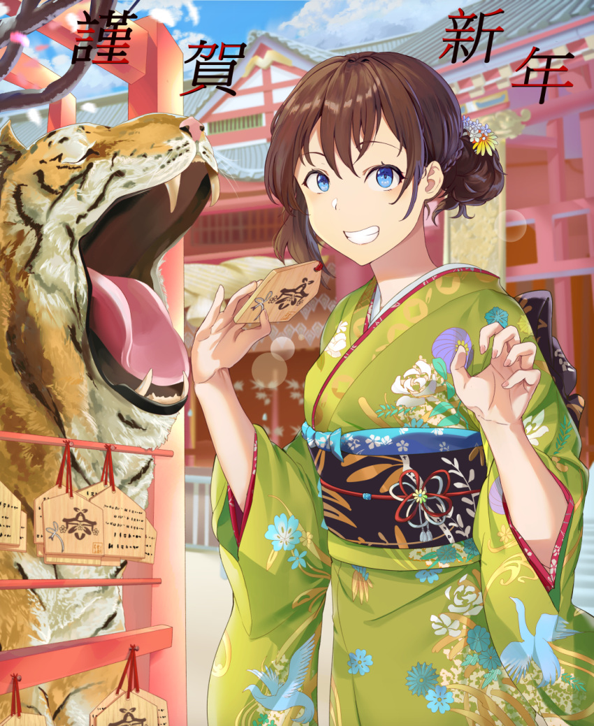 1girl animal bangs blue_eyes blue_flower branch brown_hair building chinese_zodiac claw_pose commentary_request day ema eyebrows_visible_through_hair floral_print flower green_kimono grin hair_between_eyes hair_bun hair_flower hair_ornament highres holding japanese_clothes kimono long_sleeves mosta_(lo1777789) obi original outdoors petals print_kimono sash smile solo tiger translated white_flower wide_sleeves year_of_the_tiger yellow_flower