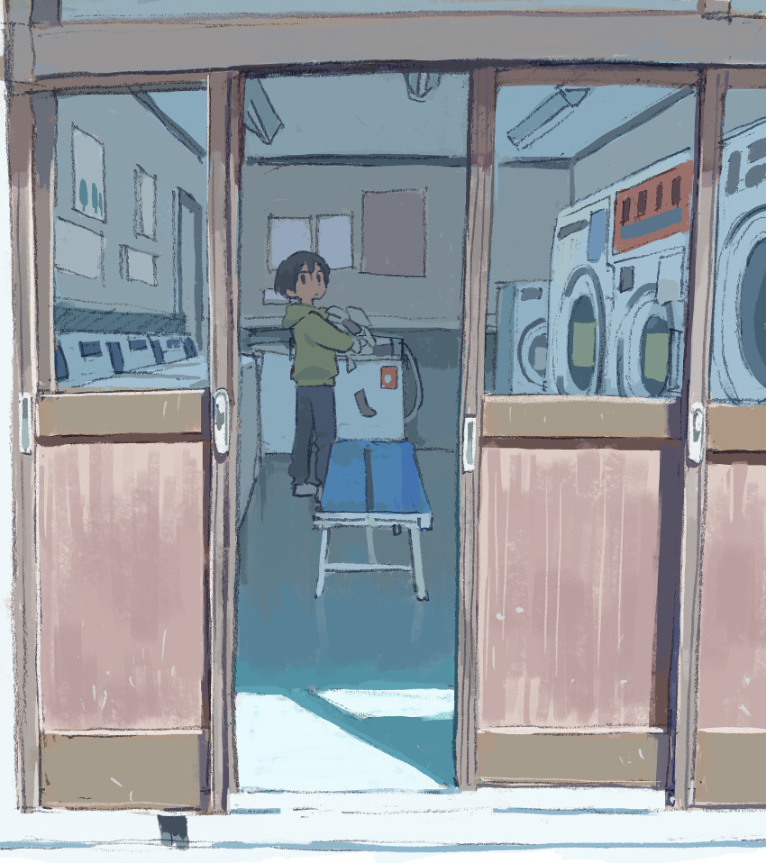 1boy absurdres bench black_hair black_pants commentary_request from_outside full_body green_hoodie highres holding holding_clothes hood hood_down hoodie laundromat looking_at_viewer male_focus muji_(uimss) original pants short_hair solo washing_machine
