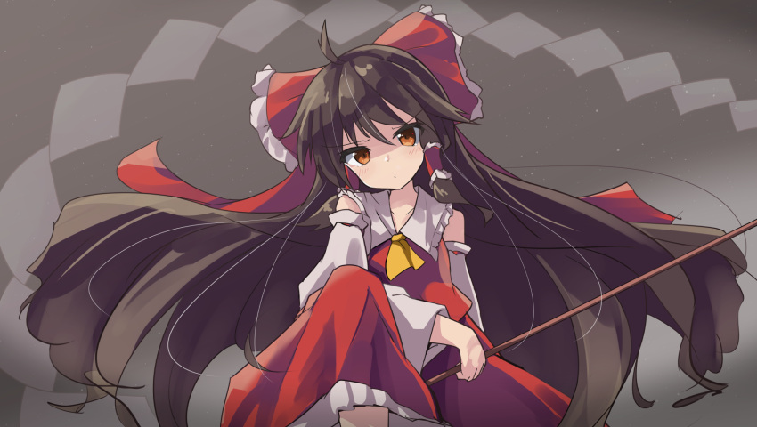 1girl ahoge ascot bangs bare_shoulders black_hair blush bow brown_eyes closed_mouth commentary_request detached_sleeves eyebrows_visible_through_hair frilled_bow frilled_skirt frills gohei hair_between_eyes hair_bow hakurei_reimu head_tilt highres holding long_hair long_sleeves looking_at_viewer one_knee red_bow red_shirt red_skirt ryogo shirt skirt sleeveless sleeveless_shirt solo touhou v-shaped_eyebrows very_long_hair white_sleeves wide_sleeves yellow_ascot