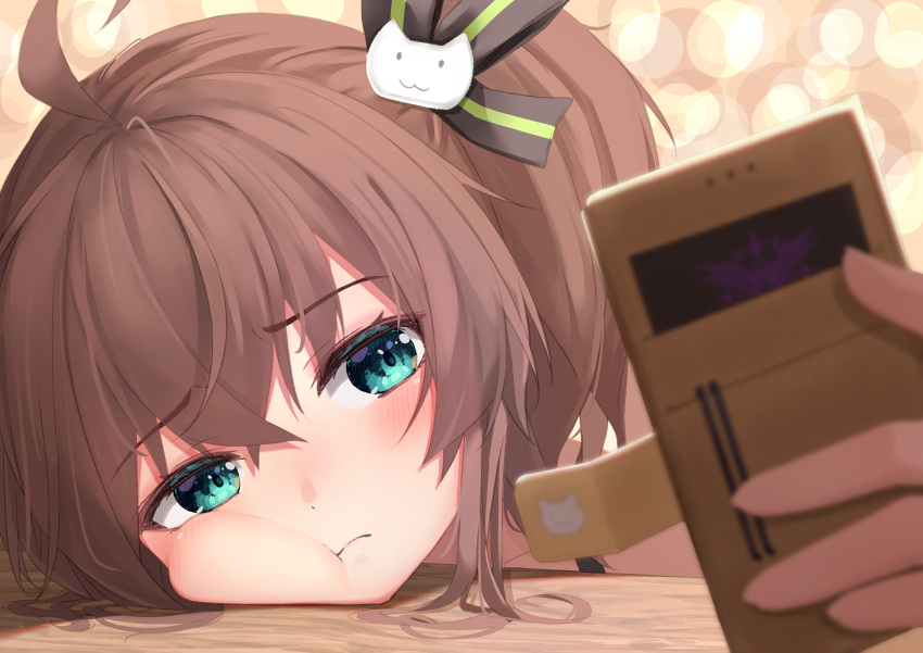 1girl :t absurdres ahoge bangs blue_eyes blurry blurry_foreground blush brown_hair cat_hair_ornament cheek_bulge closed_mouth commentary_request depth_of_field eyebrows_visible_through_hair face hair_between_eyes hair_ornament hair_ribbon highres holding holding_phone hololive looking_at_phone natsuiro_matsuri one_side_up phone ribbon selfie solo starkamisan virtual_youtuber
