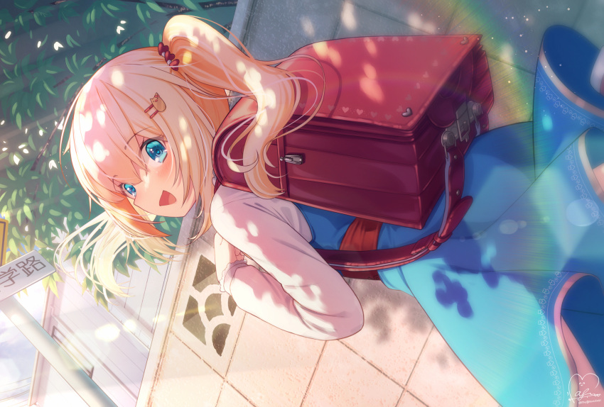 1girl :d akai_haato backpack bag bangs blonde_hair blue_dress blue_eyes commentary_request day dress dutch_angle eyebrows_visible_through_hair hair_between_eyes hair_ornament heart heart_hair_ornament highres hololive long_hair looking_at_viewer magowasabi outdoors shirt side_ponytail signature smile solo twitter_username virtual_youtuber white_shirt