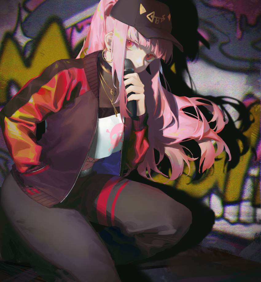 1girl absurdres bangs baseball_cap covered_mouth covering covering_mouth crop_top earrings graffiti hat highres holding holding_microphone hololive hololive_english ilion jacket jewelry kneeling looking_at_viewer microphone mori_calliope multicolored_clothes multicolored_jacket necklace pants pink_eyes pink_hair ponytail see-through shadow skull_print solo sweatpants virtual_youtuber