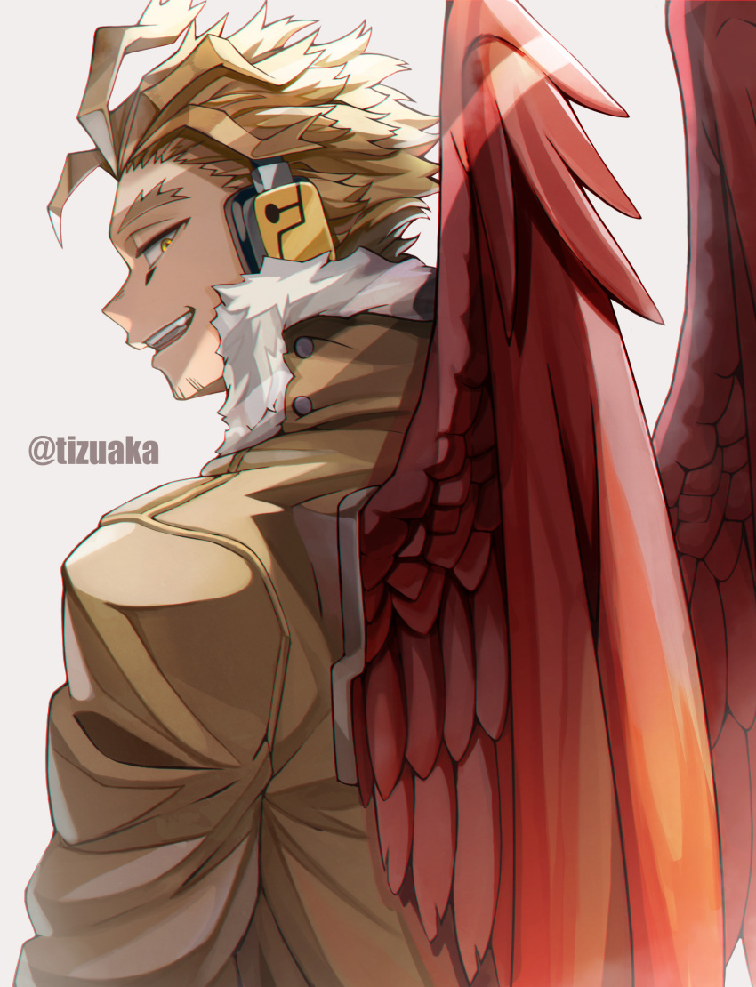 1boy blonde_hair boku_no_hero_academia costume facial_hair facial_mark feathered_wings from_behind fur-trimmed_jacket fur_trim goatee grin hawks_(boku_no_hero_academia) headphones highres jacket long_bangs looking_at_viewer looking_back male_focus open_mouth red_feathers red_wings shadow short_hair simple_background smile solo tonbanlove twitter_username wings yellow_eyes