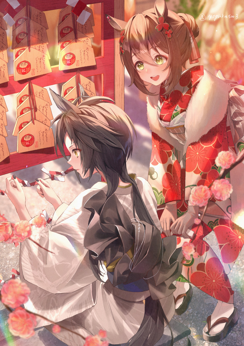 2girls absurdres air_shakur_(umamusume) alternate_hairstyle animal_ears bangs black_footwear black_hair blurry blurry_background brown_hair closed_mouth commentary_request day depth_of_field ema fine_motion_(umamusume) floral_print flower hair_bun hair_ornament hair_up hands_on_own_knees hatsumoude highres horse_ears horse_girl horse_tail japanese_clothes kimono light_frown long_sleeves multiple_girls obi open_mouth outdoors partial_commentary pink_flower red_kimono sandals sash short_hair sidelocks smile squatting standing tabi tail twitter_username umamusume white_kimono white_legwear yellow_eyes yogukasu