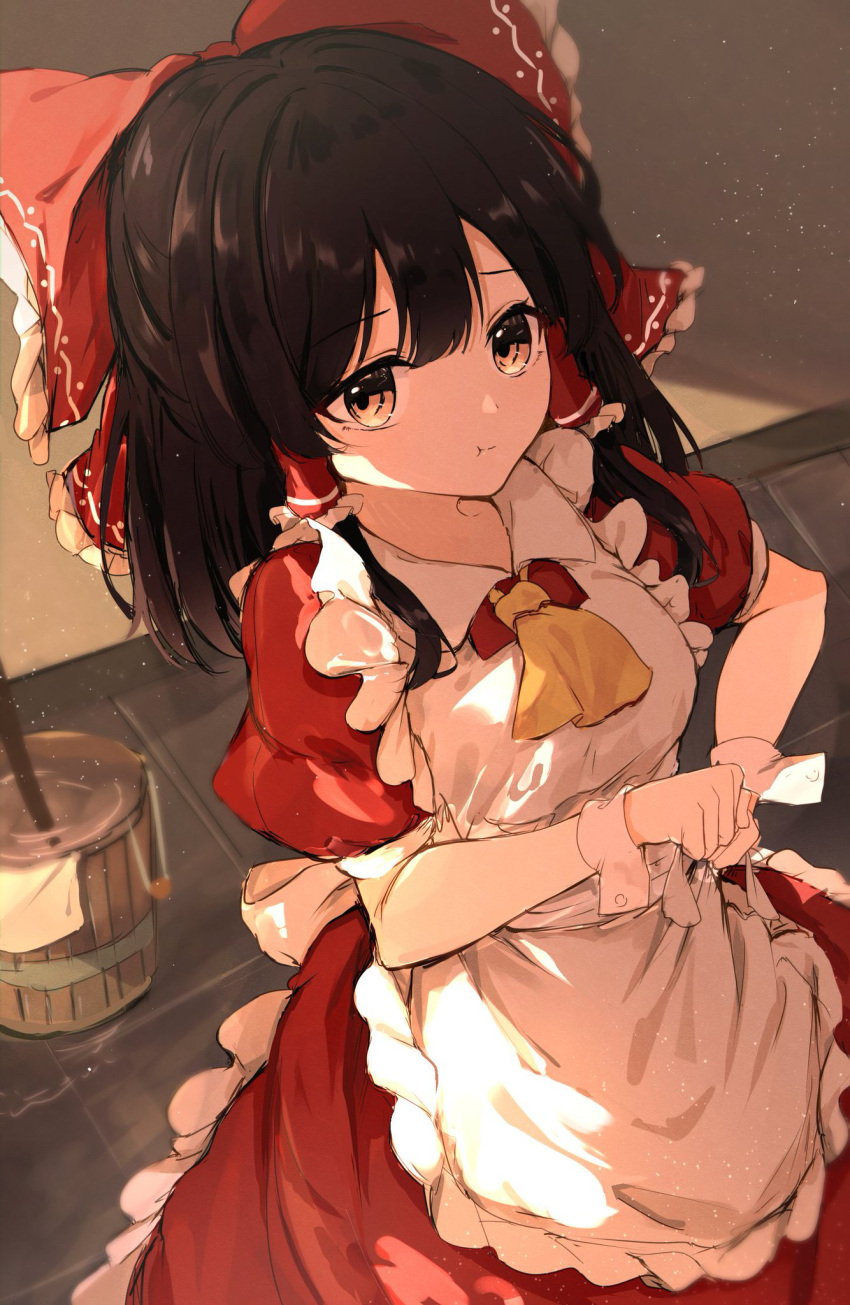 1girl alternate_costume apron ascot black_hair bow brown_eyes bucket closed_mouth dress enmaided hair_between_eyes hair_bow hair_tubes hakurei_reimu highres hunya maid maid_apron medium_hair pout puffy_short_sleeves puffy_sleeves red_bow red_dress short_sleeves sidelocks solo touhou white_apron wrist_cuffs yellow_ascot