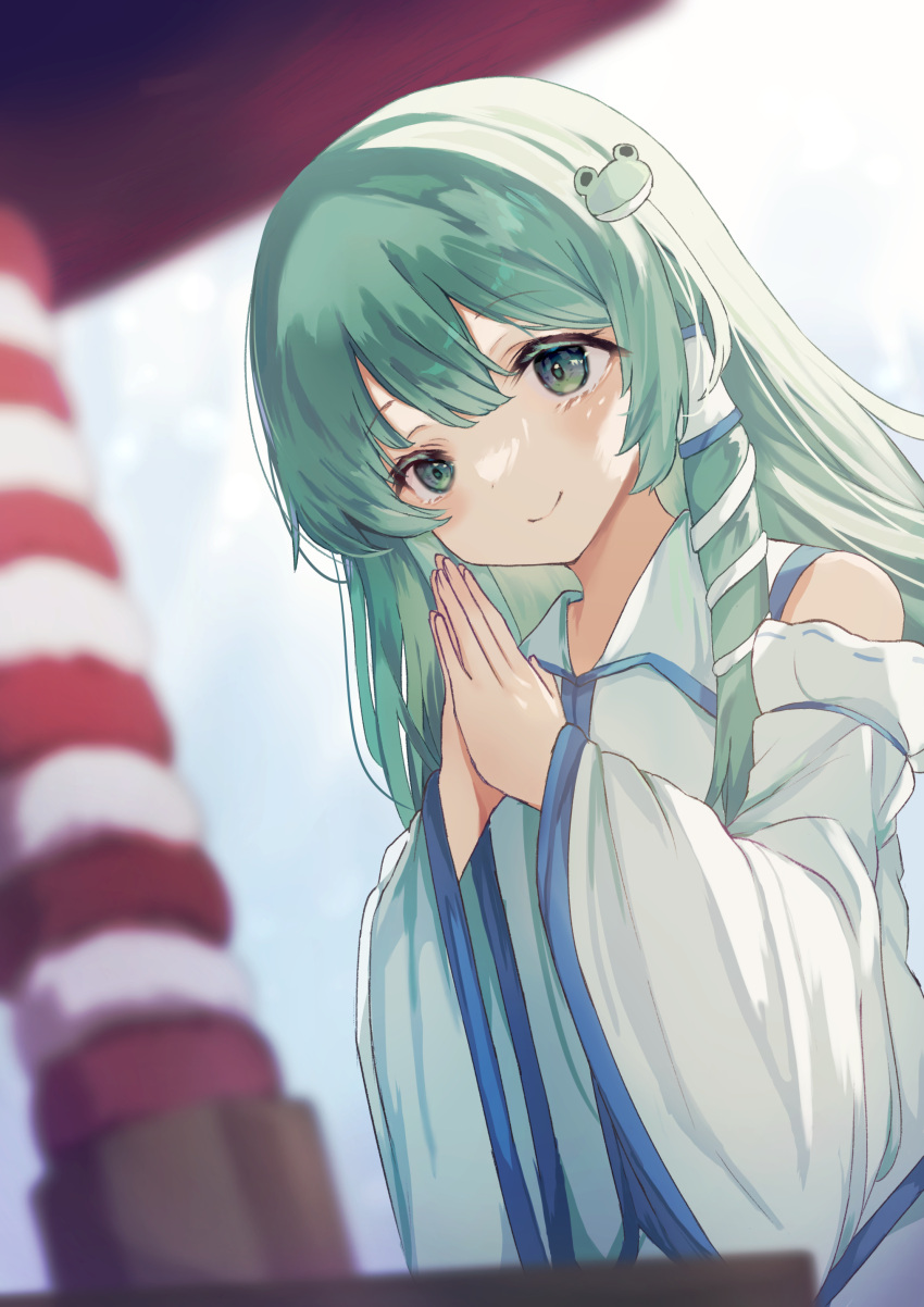 1girl absurdres bangs bare_shoulders blue_skirt blue_sky blurry blurry_background closed_mouth collared_shirt detached_sleeves eyebrows_visible_through_hair frog_hair_ornament gradient gradient_sky green_eyes green_hair hair_between_eyes hair_ornament hair_tubes hands_up highres kochiya_sanae kogalashi long_hair long_sleeves looking_at_viewer moriya_shrine own_hands_together shirt shrine skirt sky smile snake_hair_ornament solo standing touhou white_shirt white_sky wide_sleeves