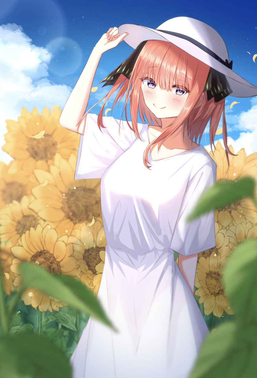 1girl absurdres arm_behind_back arm_up bangs black_ribbon blue_eyes blunt_bangs blush breasts butterfly_hair_ornament collarbone dress field flower flower_field go-toubun_no_hanayome hair_ornament hat highres holding holding_clothes holding_hat large_breasts looking_at_viewer mugi_(mugi0016) nakano_nino outdoors pink_hair raised_eyebrows ribbon smile summer sundress sunflower twintails white_dress