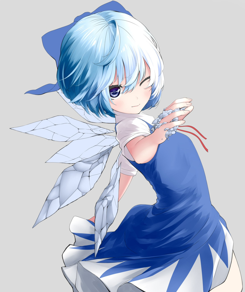 1girl ahoge amazaki_ria bangs blue_bow blue_dress blue_eyes blue_hair bow cirno closed_mouth dress from_side grey_background hair_bow highres ice ice_wings looking_at_viewer one_eye_closed short_hair short_sleeves simple_background solo touhou wings