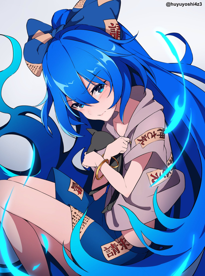 1girl bangle blue_bow blue_eyes blue_hair blush bow bracelet closed_mouth eyebrows_visible_through_hair feet_out_of_frame grey_hoodie hair_between_eyes hair_bow highres hood hoodie jewelry long_hair short_sleeves solo stuffed_animal stuffed_cat stuffed_toy touhou twitter_username very_long_hair yorigami_shion yoshinatsu