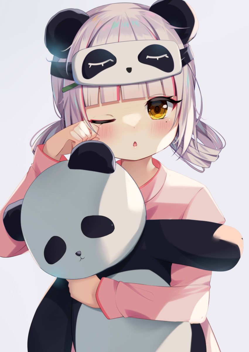 1girl absurdres aika_meru animal_ears blush eye_mask fake_animal_ears highres ikazu401 looking_at_viewer mole mole_under_eye object_hug one_eye_closed pale_skin panda rubbing_eyes silver_hair solo stuffed_toy tired twintails virtual_youtuber yellow_eyes yume_reality