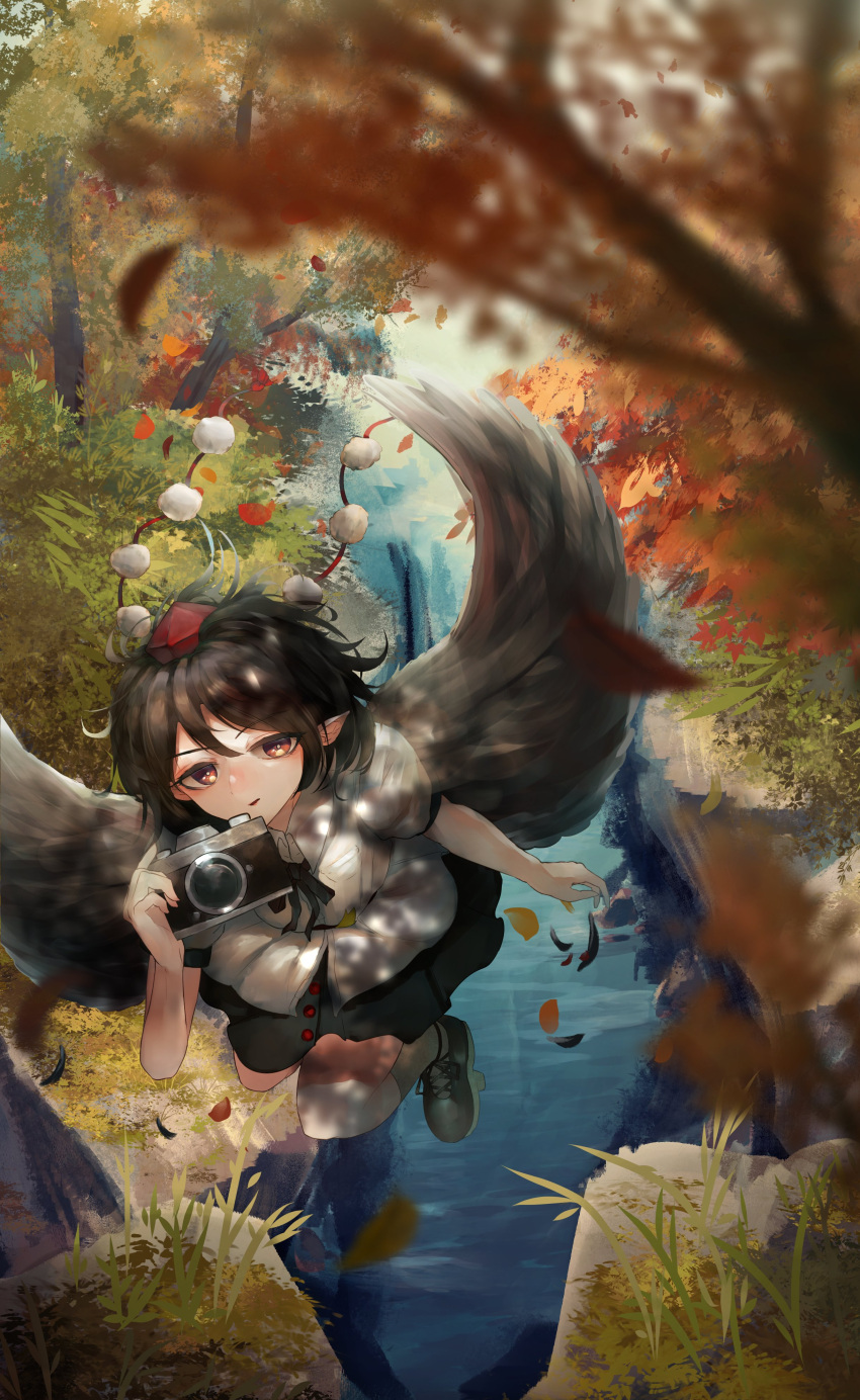 1girl absurdres belt bird_wings black_belt black_feathers black_hair black_ribbon black_skirt black_wings breasts camera collared_shirt commentary_request day feathered_wings feathers flying grass hat highres holding holding_camera medium_breasts miniskirt nanaironokabi outdoors pointy_ears puffy_short_sleeves puffy_sleeves red_eyes red_headwear ribbon rock shameimaru_aya shirt short_hair short_sleeves skirt tassel tokin_hat touhou tree white_shirt wings