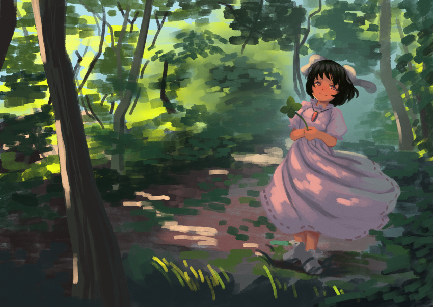 1girl animal_ears bangs black_hair carrot_necklace closed_mouth clover commentary_request dress floppy_ears forest four-leaf_clover fujimi_nao full_body highres holding_clover inaba_tewi long_dress looking_at_viewer nature outdoors pink_dress rabbit_ears rabbit_girl red_eyes ribbon-trimmed_dress short_hair smile solo standing touhou tree wavy_hair
