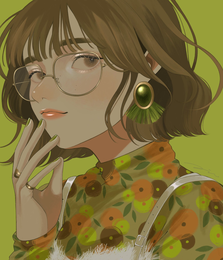 1girl brown_eyes brown_hair commentary earrings food_print glasses green_background green_nails green_shirt hand_up highres jewelry long_sleeves looking_at_viewer mole_on_cheek multiple_rings orange_lips original ring shirt short_hair simple_background solo tori_no_3046 turtleneck upper_body