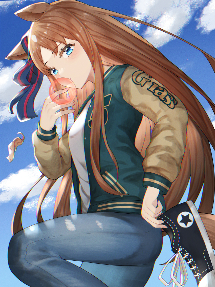 1girl absurdres animal_ears bangs blue_eyes blush brown_hair bubble_blowing candy_wrapper chewing_gum clouds denim grass_wonder_(umamusume) highres holding holding_shoes horse_ears horse_girl horse_tail jacket jeans knee_up letterman_jacket long_hair long_sleeves looking_at_viewer outdoors pants pearlscale0818 shirt shoes sneakers solo tail umamusume white_shirt