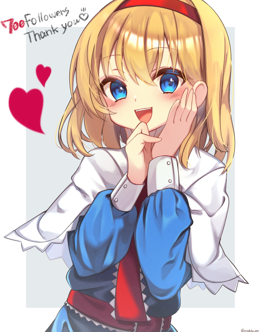 1girl alice_margatroid bangs belt blonde_hair blue_dress blue_eyes blush border buttons capelet commentary_request dress english_text eyebrows_visible_through_hair eyes_visible_through_hair fang fangs grey_background hair_between_eyes hairband hand_on_own_face hands_up highres long_sleeves looking_to_the_side necktie open_mouth outside_border puffy_long_sleeves puffy_sleeves red_belt red_hairband red_heart red_necktie short_hair simple_background smile solo teeth tongue touhou twitter_username white_border yuineko