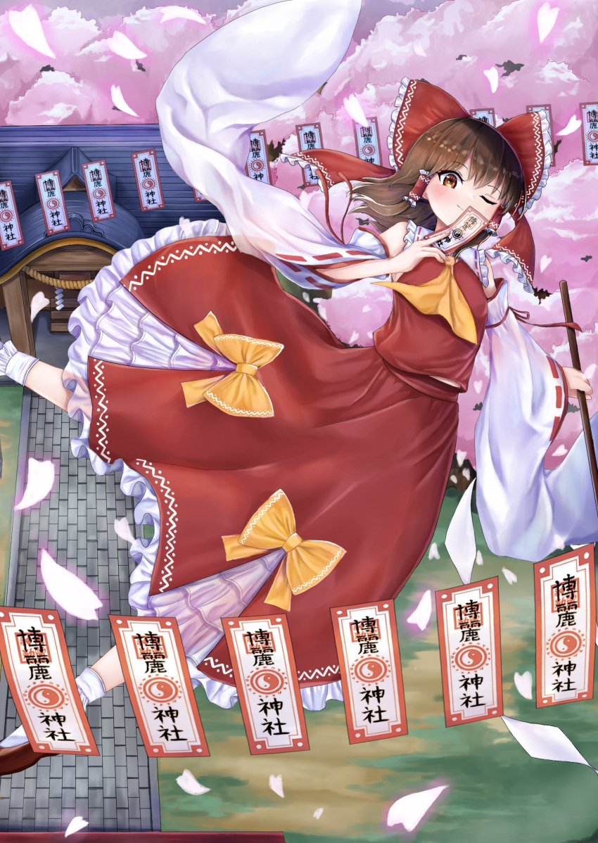 1girl ascot bangs bare_shoulders blush bow brown_eyes brown_footwear brown_hair cherry_blossoms closed_mouth collared_shirt commentary_request detached_sleeves eyebrows_visible_through_hair fingernails flying frills gohei hair_between_eyes hair_ornament hair_tubes hakurei_reimu hakurei_shrine hand_up highres long_skirt long_sleeves looking_at_viewer ofuda one_eye_closed petals red_bow red_skirt red_vest remitei03 shirt shoes short_hair shrine skirt smile socks solo torii touhou tree vest white_legwear white_shirt wide_sleeves yellow_ascot yellow_bow