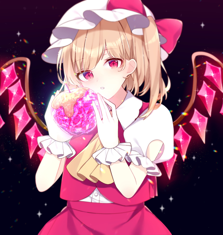 +_+ 1girl apple ascot black_background blonde_hair blush bow collared_shirt crystal crystal_apple eyebrows_visible_through_hair flandre_scarlet food frilled_sleeves frills fruit glowing hands_up hat hat_bow head_tilt highres holding holding_food holding_fruit looking_at_viewer mob_cap one_side_up parted_lips puffy_short_sleeves puffy_sleeves red_bow red_eyes red_skirt red_vest shirt short_hair short_sleeves simple_background skirt symbol-only_commentary symbol-shaped_pupils touhou upper_body vest white_headwear white_shirt wings wrist_cuffs yellow_ascot yurui_tuhu