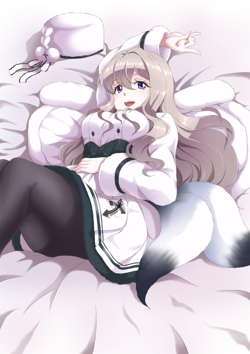 1girl azur_lane bangs black_legwear blonde_hair blue_eyes blush breasts coat coat_dress dress eyebrows_visible_through_hair feet_out_of_frame hand_on_own_stomach heterochromia highres long_hair looking_at_viewer lying medium_breasts murmansk_(azur_lane) on_bed open_mouth pantyhose shiruppo smile solo tail teeth upper_teeth violet_eyes white_coat white_dress