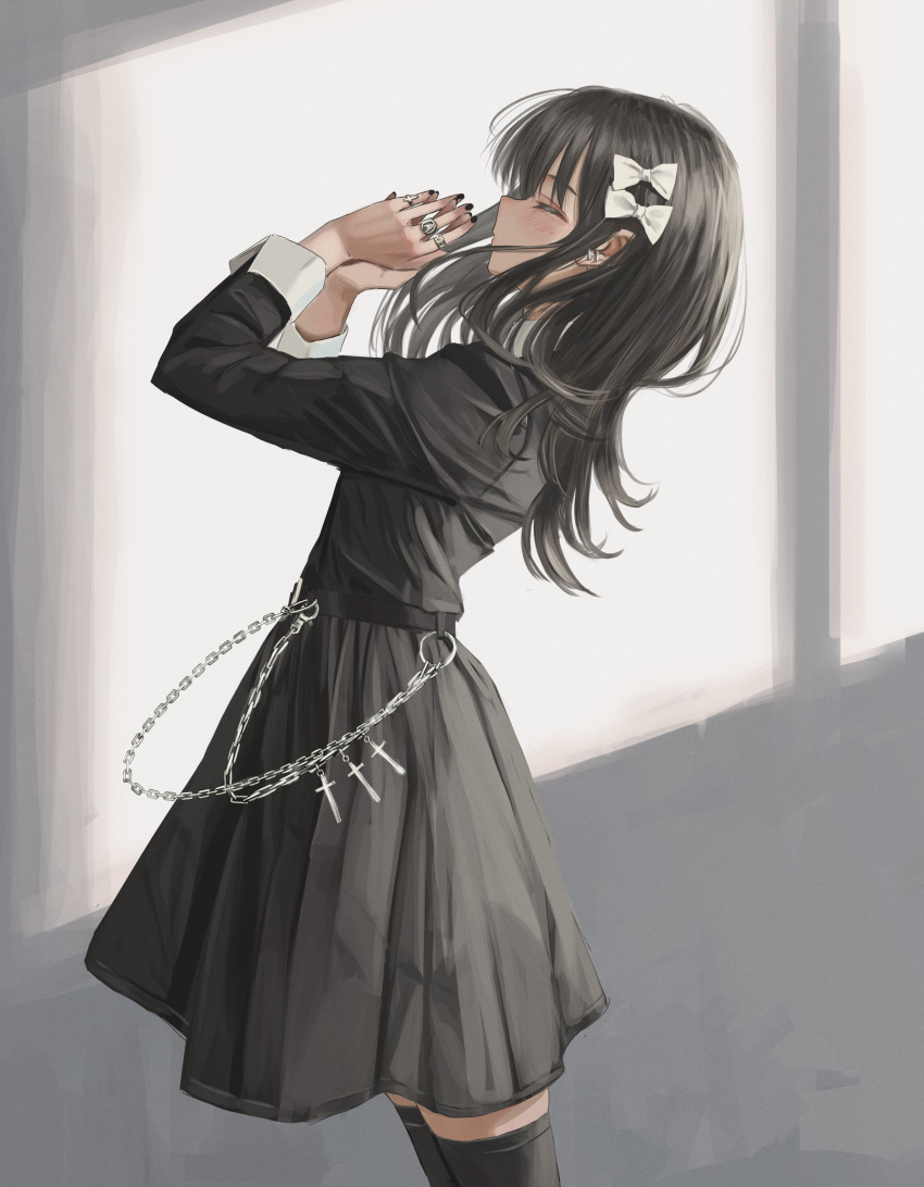 1girl absurdres belt black_dress black_hair black_nails blush bow chain closed_eyes closed_mouth cross cuffs dress ear_piercing earrings facing_to_the_side hair_bow highres jewelry leaning_back long_hair multiple_rings nadegata original own_hands_clasped own_hands_together piercing praying ring thigh-highs white_bow window zettai_ryouiki